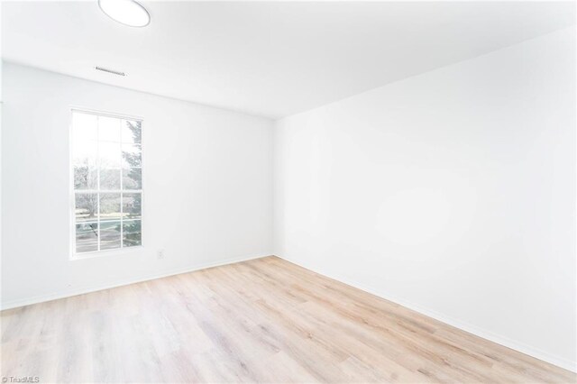 4114 Rose Lake Dr, Greensboro, NC 27407 - empty room with light wood-type flooring