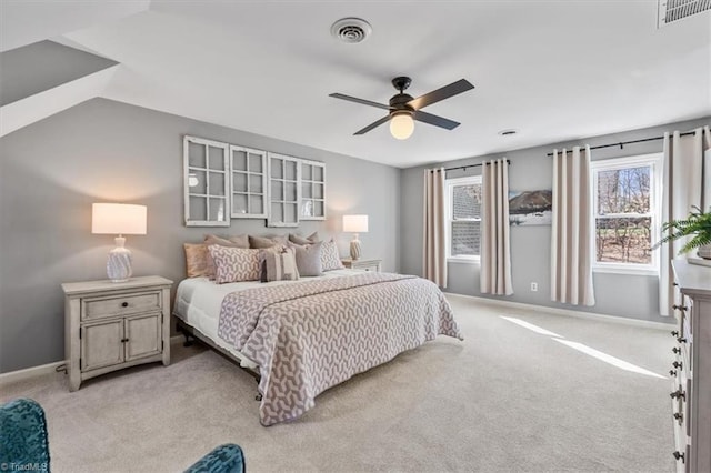 bedroom featuring light carpet, visible vents, ceiling fan, and baseboards