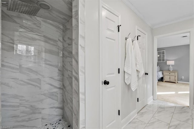 bathroom featuring a marble finish shower, baseboards, marble finish floor, and crown molding