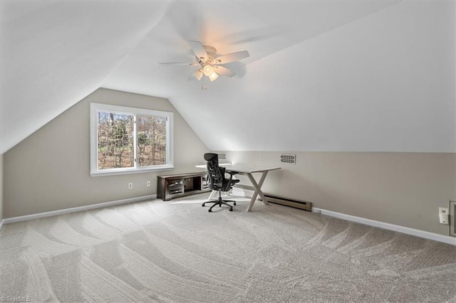 carpeted office with ceiling fan, baseboards, and vaulted ceiling