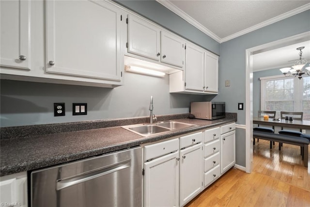 kitchen with sink, white cabinets, and stainless steel appliances