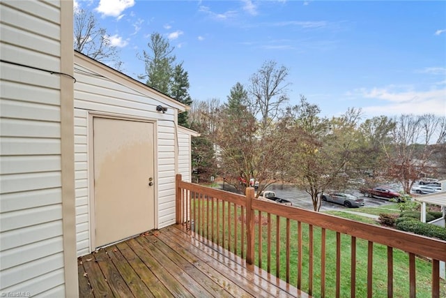 wooden terrace with a yard