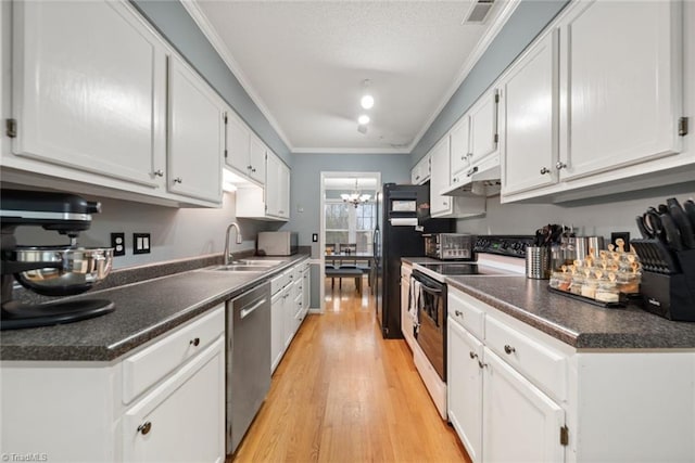 kitchen with light hardwood / wood-style floors, white cabinetry, white appliances, and sink