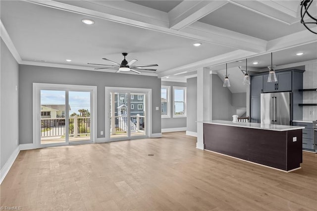 unfurnished living room with ceiling fan, crown molding, beam ceiling, and hardwood / wood-style floors