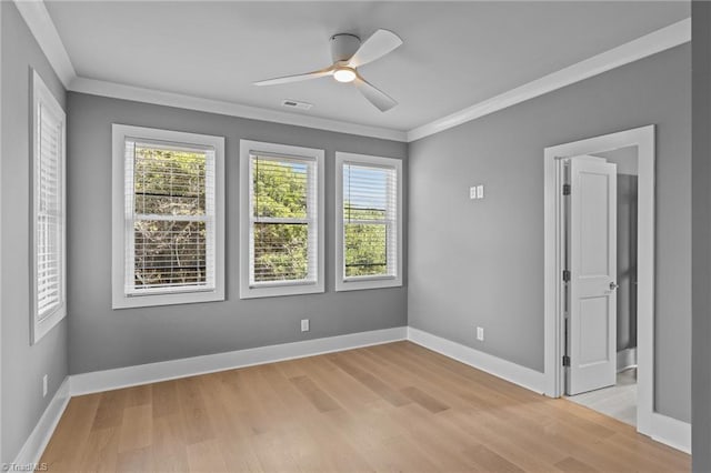 101 Melanie St, Emerald Isle, NC 28594 - empty room with ceiling fan, a wealth of natural light, and light wood-style floors