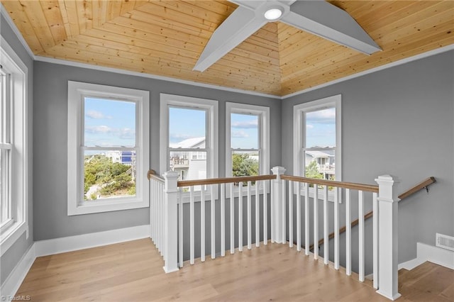 unfurnished sunroom with wood ceiling and vaulted ceiling