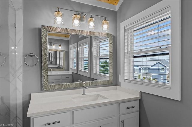 bathroom with vanity and a healthy amount of sunlight