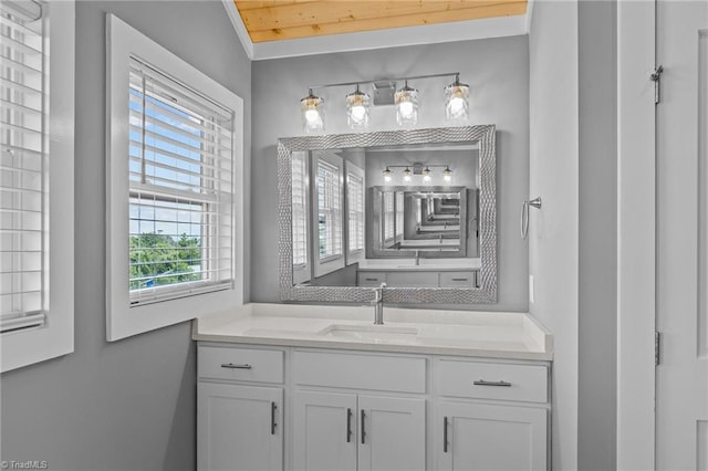 bathroom with vanity, a healthy amount of sunlight, wooden ceiling, and lofted ceiling