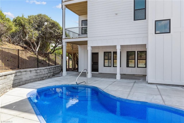 view of pool featuring a patio