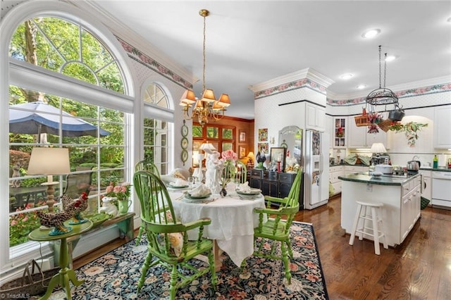 2792 Fieldwood Ct, Winston-Salem, NC 27106 - dining area featuring a chandelier, crown molding, and dark wood-style flooring