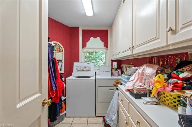 2792 Fieldwood Ct, Winston-Salem, NC 27106 - laundry room with washing machine and dryer, light tile patterned floors, and cabinet space