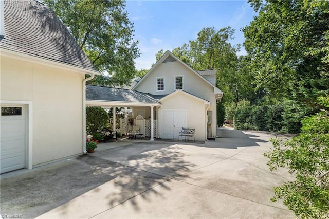 2792 Fieldwood Ct, Winston-Salem, NC 27106 - view of property exterior with stucco siding and roof with shingles