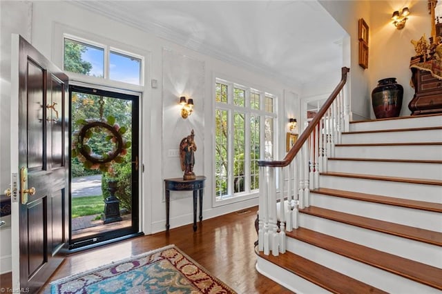 2792 Fieldwood Ct, Winston-Salem, NC 27106 - foyer entrance with stairs, healthy amount of natural light, wood finished floors, and crown molding