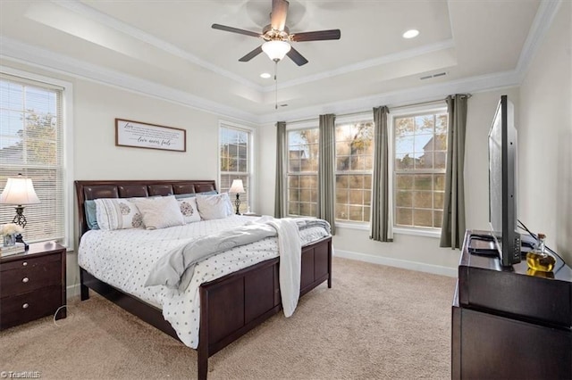 bedroom featuring light carpet, multiple windows, and ceiling fan