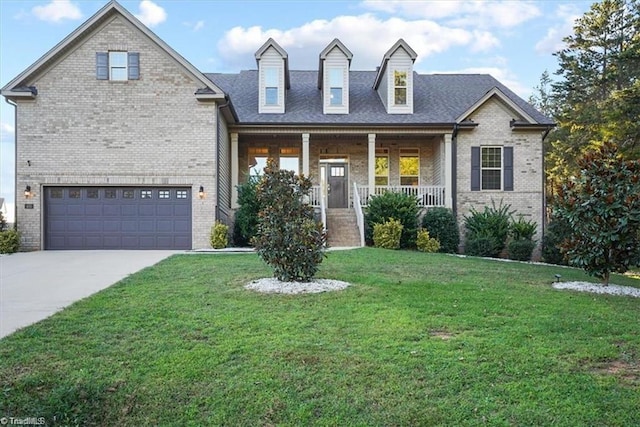 view of front facade featuring a front lawn, covered porch, and a garage