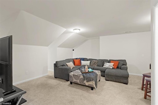 living room featuring light carpet and vaulted ceiling