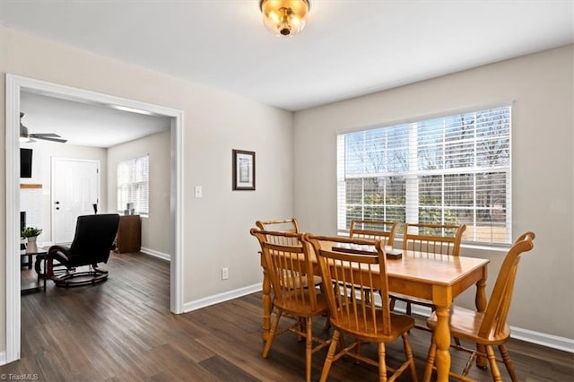 dining room featuring dark hardwood / wood-style floors and ceiling fan