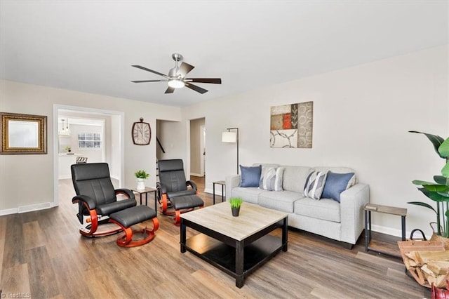 living room with hardwood / wood-style flooring and ceiling fan