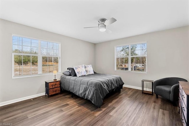 bedroom featuring ceiling fan and dark hardwood / wood-style flooring