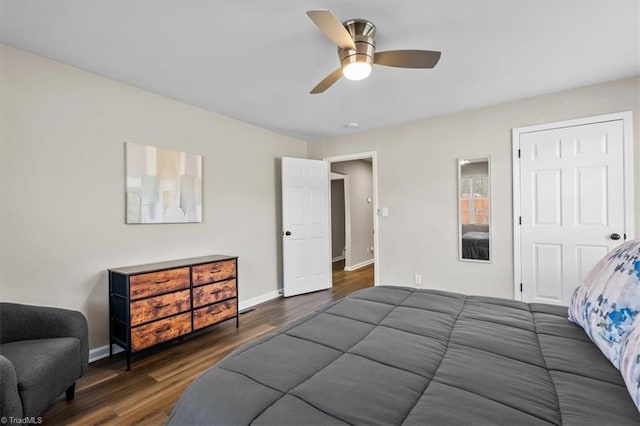 bedroom featuring ceiling fan and dark hardwood / wood-style flooring