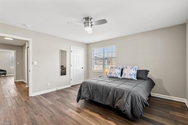 bedroom featuring dark wood-type flooring and ceiling fan