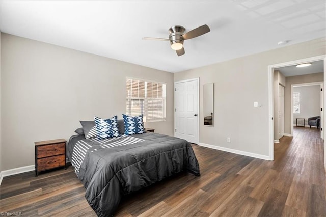 bedroom featuring dark wood-type flooring and ceiling fan