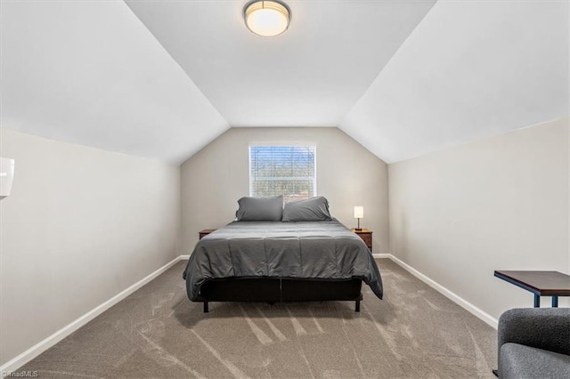 carpeted bedroom featuring vaulted ceiling