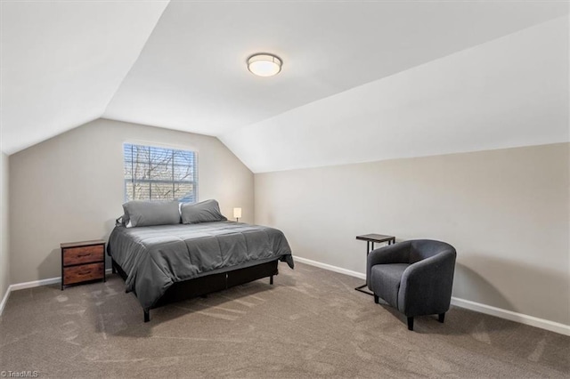 carpeted bedroom featuring lofted ceiling