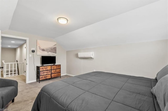 carpeted bedroom featuring lofted ceiling and a wall mounted air conditioner