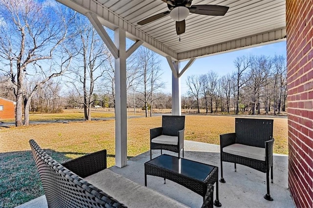 view of patio featuring ceiling fan