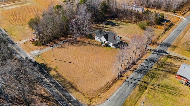 birds eye view of property with a rural view