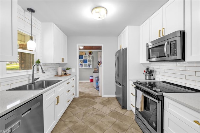 8194 Brotherstwo Rd, Colfax, NC 27235 - kitchen with appliances with stainless steel finishes, decorative backsplash, white cabinets, and decorative light fixtures