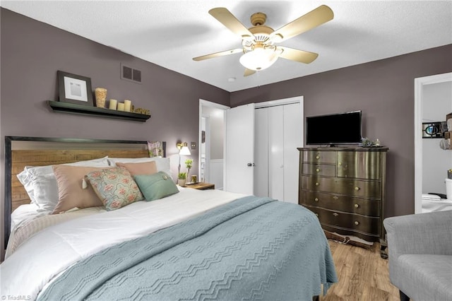 8194 Brotherstwo Rd, Colfax, NC 27235 - bedroom with wood finished floors, a closet, and ceiling fan