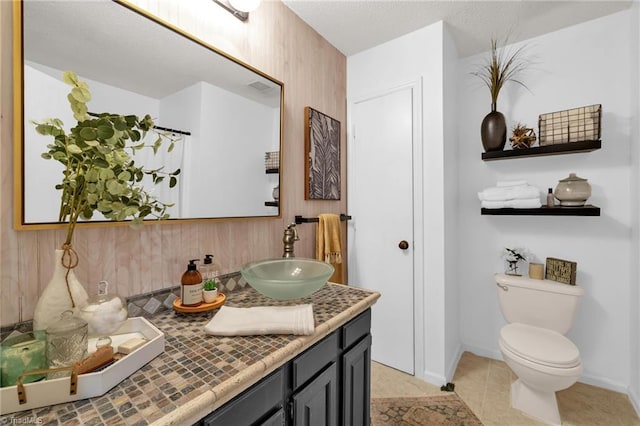 8194 Brotherstwo Rd, Colfax, NC 27235 - bathroom with vanity, tile patterned floors, and backsplash