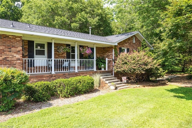 8194 Brotherstwo Rd, Colfax, NC 27235 - single story home with brick siding, a front lawn, a porch, and a shingled roof