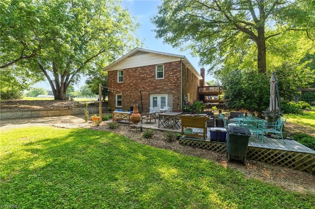 8194 Brotherstwo Rd, Colfax, NC 27235 - back of house with a deck, brick siding, french doors, a yard, and a patio