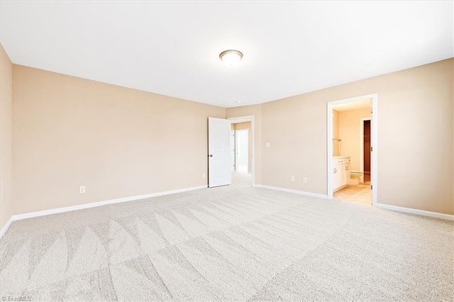 unfurnished room with light carpet