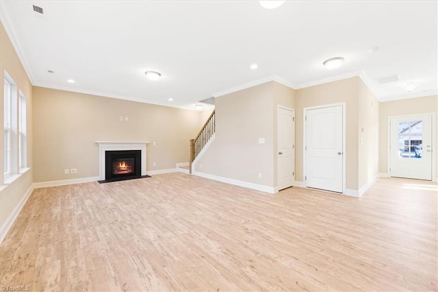 unfurnished living room featuring light hardwood / wood-style floors and ornamental molding