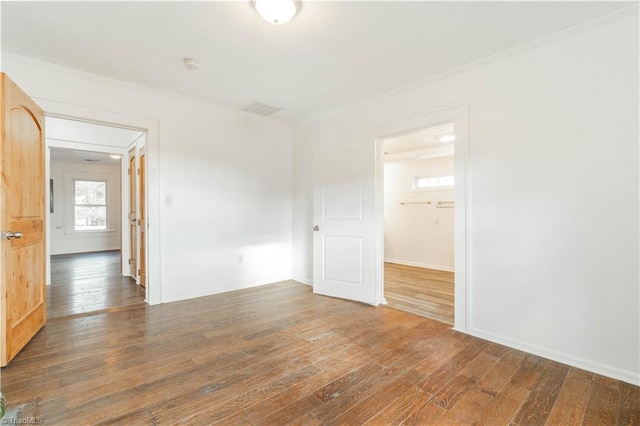 empty room featuring dark hardwood / wood-style flooring