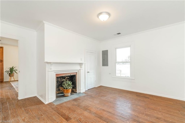 unfurnished living room featuring ornamental molding and hardwood / wood-style floors