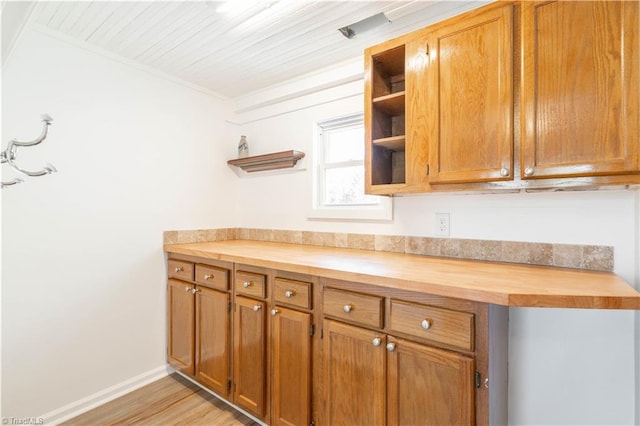 kitchen with light hardwood / wood-style floors and butcher block countertops