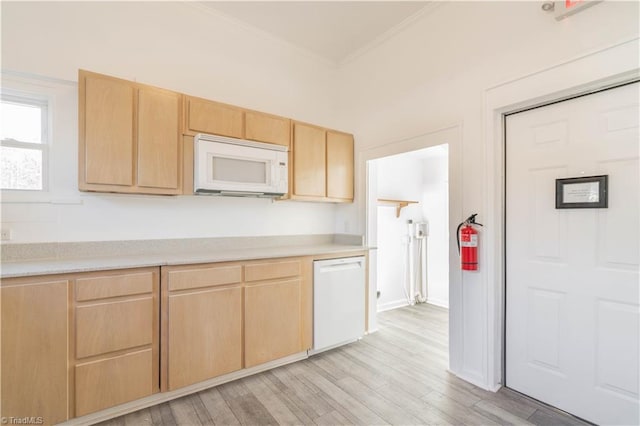 kitchen with white appliances, crown molding, light wood-type flooring, and light brown cabinetry