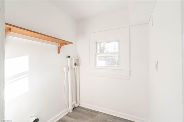 washroom featuring electric dryer hookup, hardwood / wood-style flooring, and hookup for a washing machine