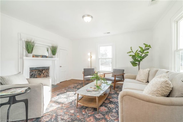 living room featuring crown molding and hardwood / wood-style flooring