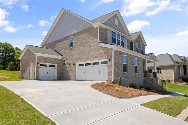 view of side of home featuring a garage and a lawn