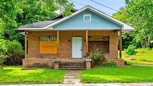 218 Robin Cir, Salisbury, NC 28144 - bungalow-style house with brick siding, a front yard, and a porch