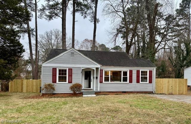 ranch-style house with a front lawn