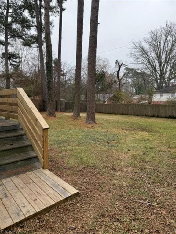 view of yard with a wooden deck