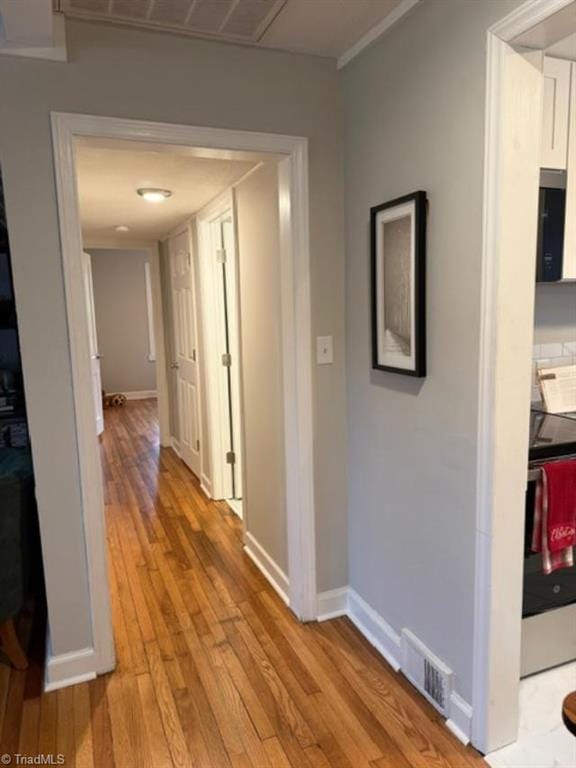 hallway featuring light hardwood / wood-style floors