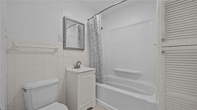 626 State Ave, High Point, NC 27262 - bathroom with shower / bath combo with shower curtain, tile walls, wainscoting, and vanity